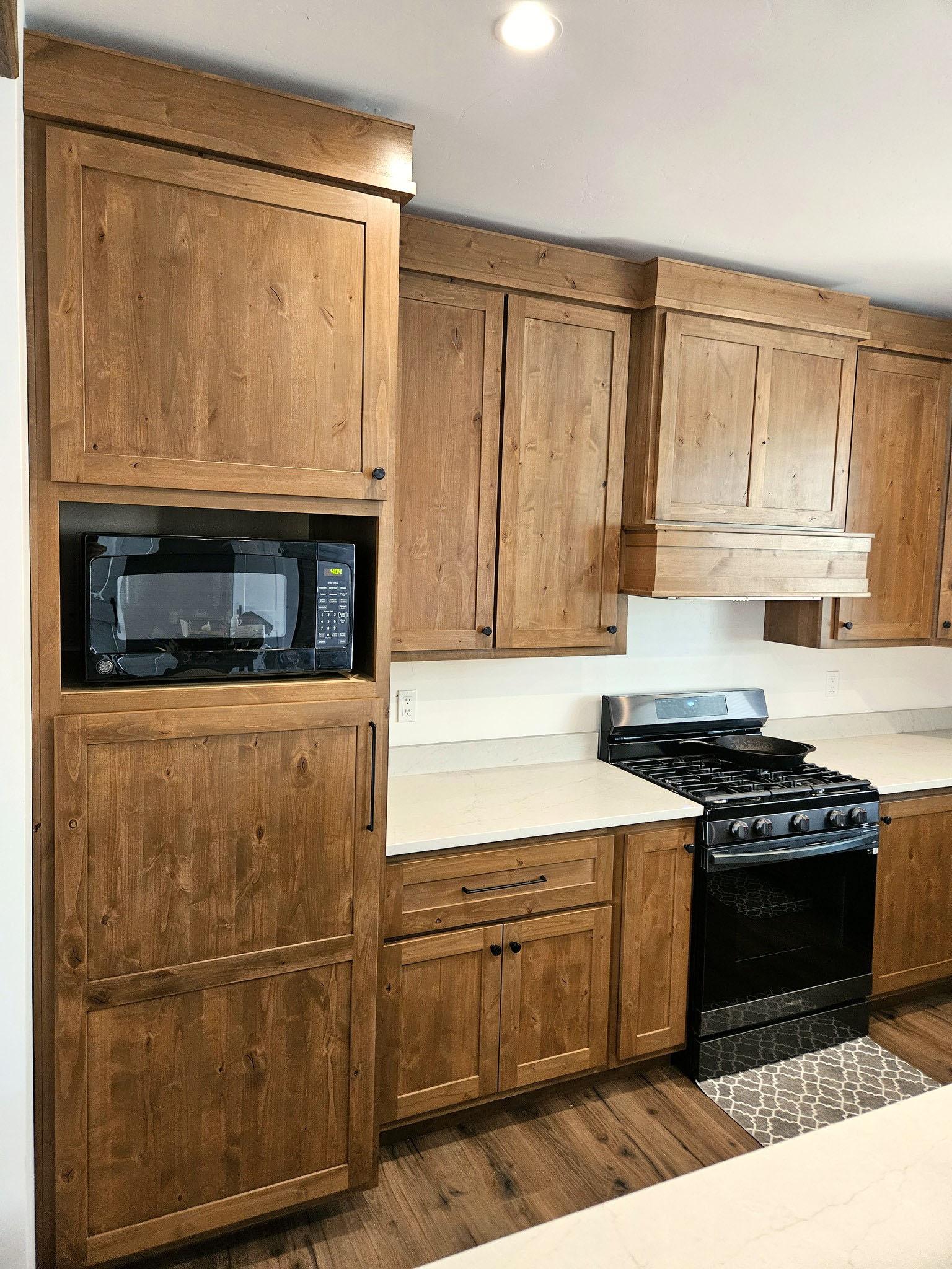 Finished kitchen cabinetry and storage in new construction project